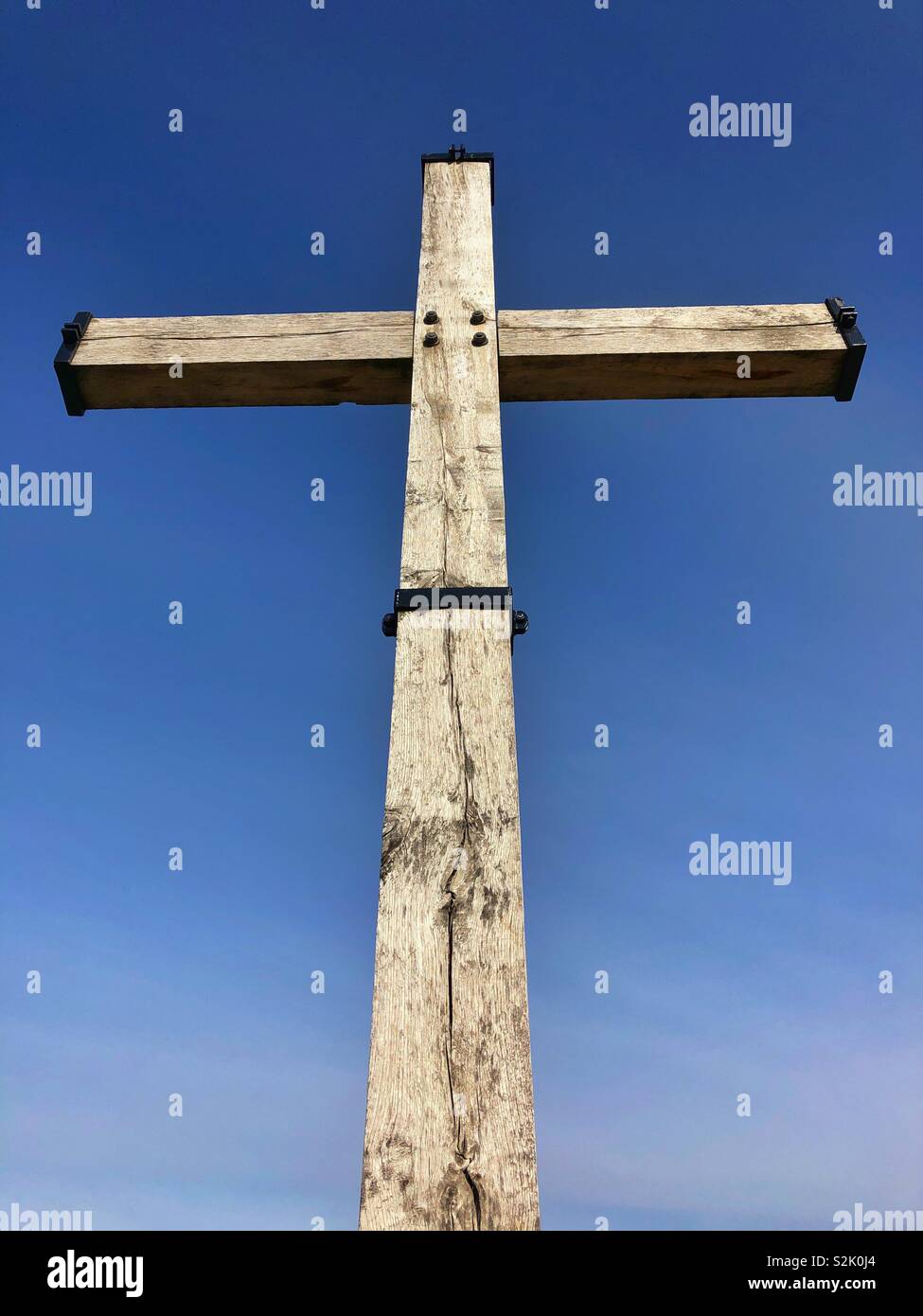 Cross memorial against a blue sky at Lochnagar crater, Somme, Hauts-de-France. - Smartphone Captured Stock Image