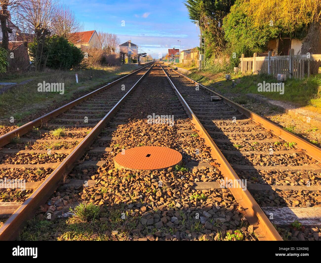 Train tracks heading through Rue, Hauts-de-France. - Smartphone Captured Stock Image