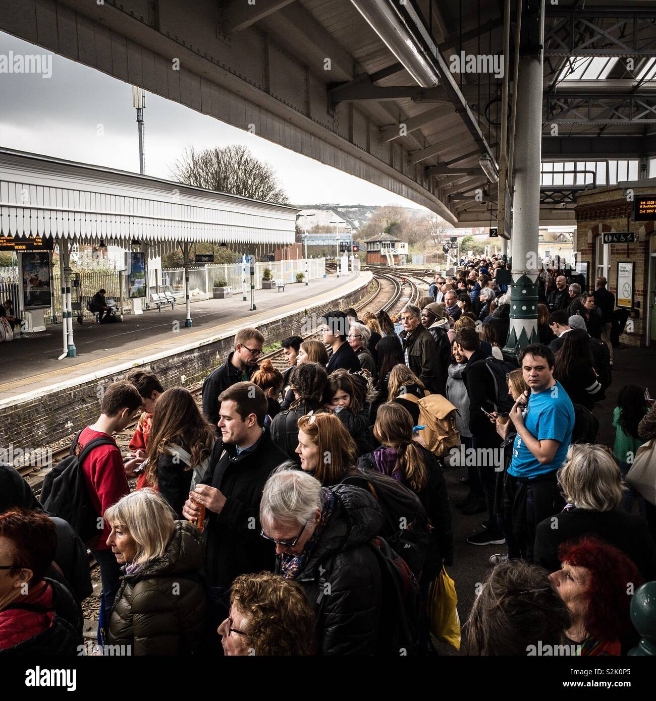 Crowds at Lewes station, West Sussex, waiting for a train to London on 23/03/2019. Many were heading to London from Brighton, diverted via Lewes due to rail engineering works. Stock Photo
