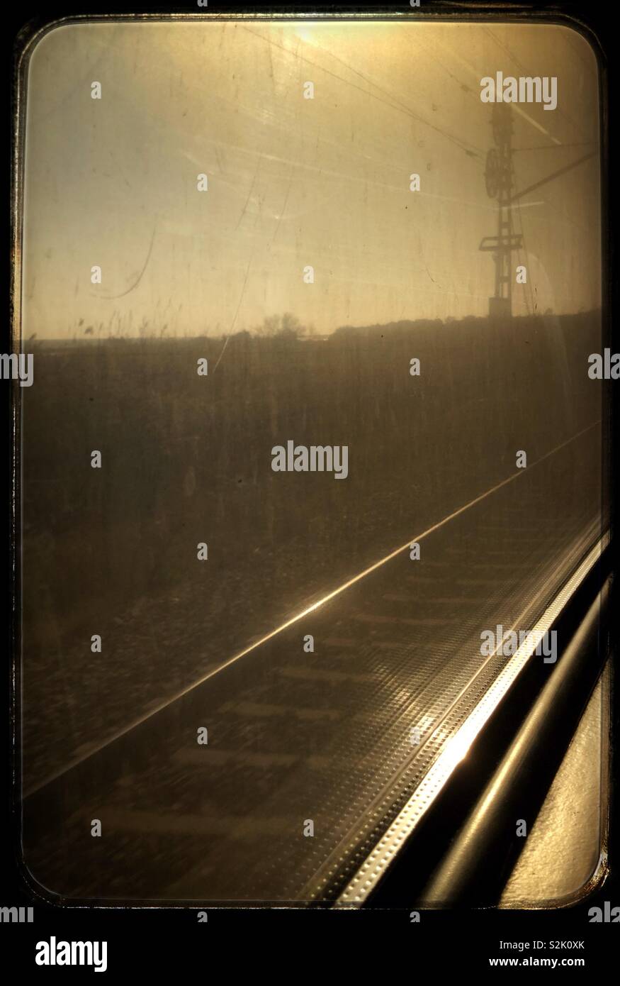 View through a dirty train window on the Catalunya Express, Catalonia, Spain. - Smartphone Captured Stock Image
