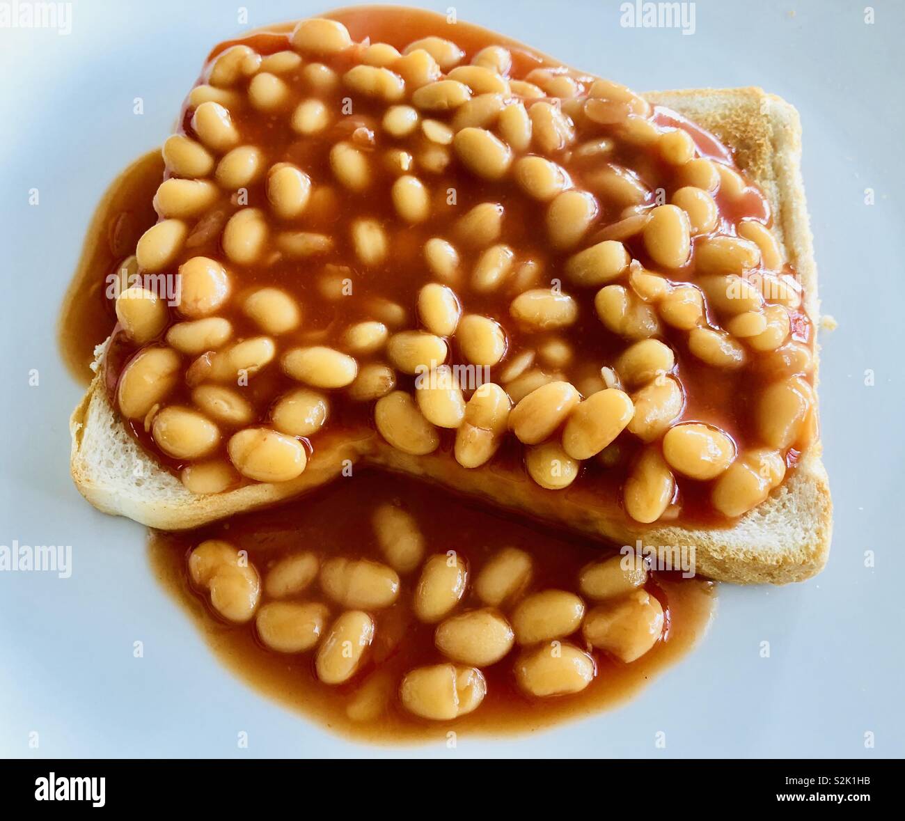 Baked beans on buttered toast Stock Photo Alamy