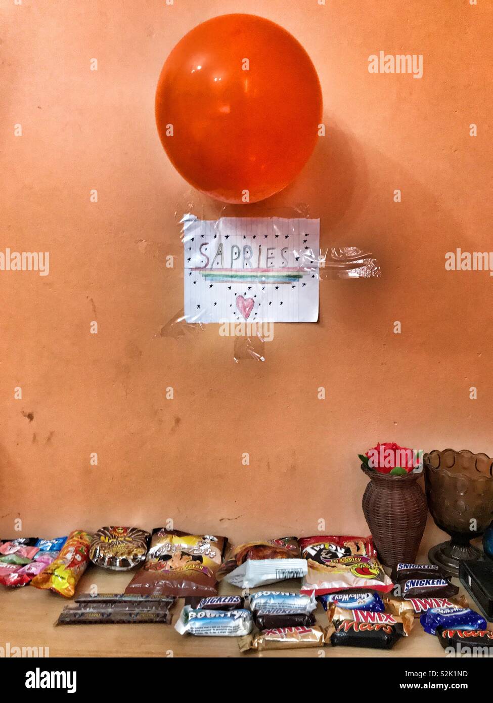 Surprise idea : an eight year old boy decided to welcome his college sister with a surprise. - Smartphone Captured Stock Image