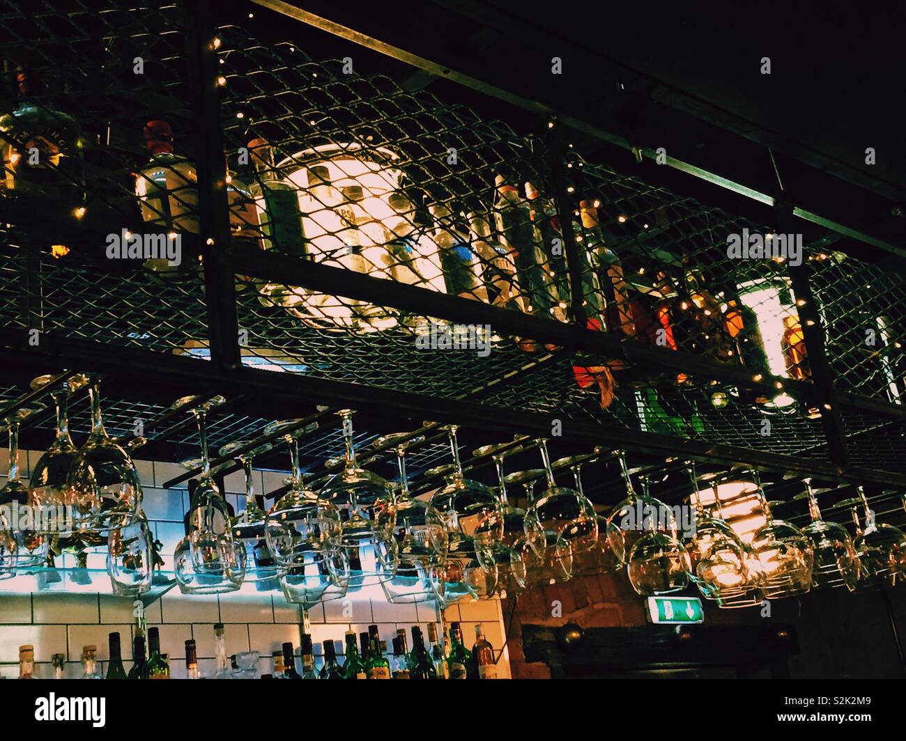 Spirits and wine glasses in a city bar uk edited with VSCO film filter - Smartphone Captured Stock Image