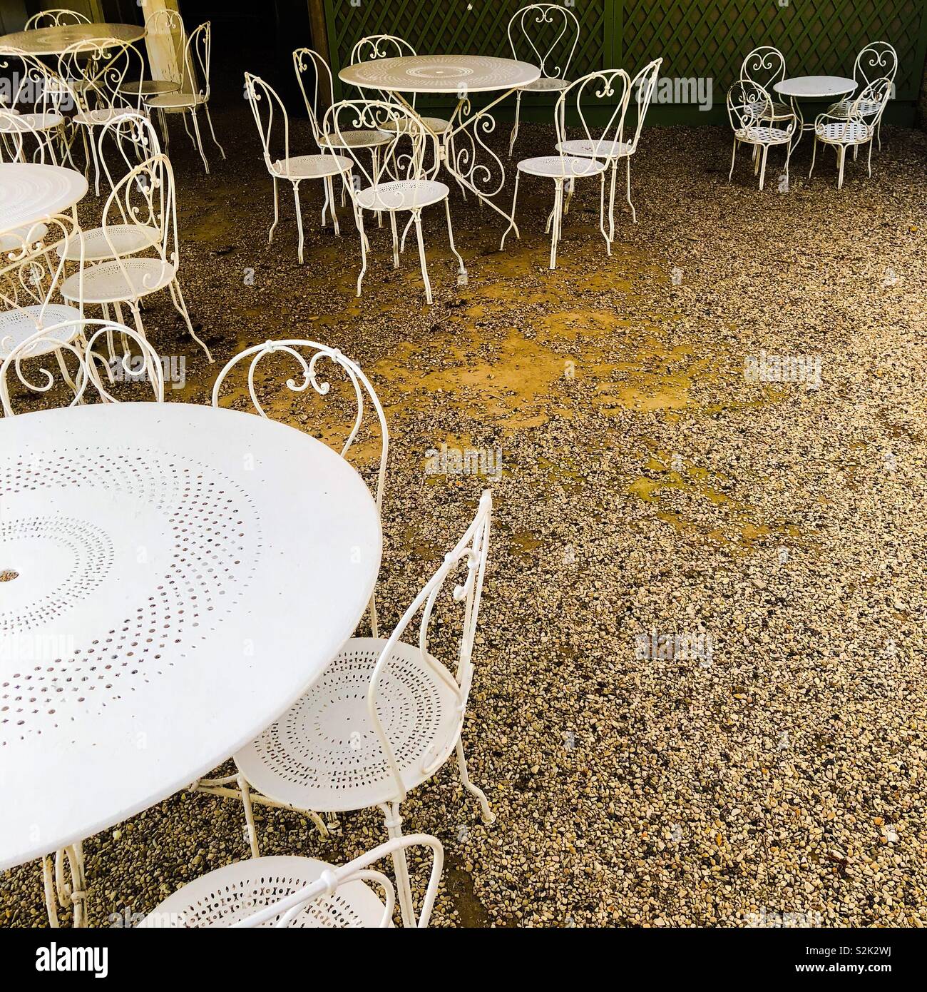 Empty outdoor tables and chairs at a closed cafe in France Stock Photo