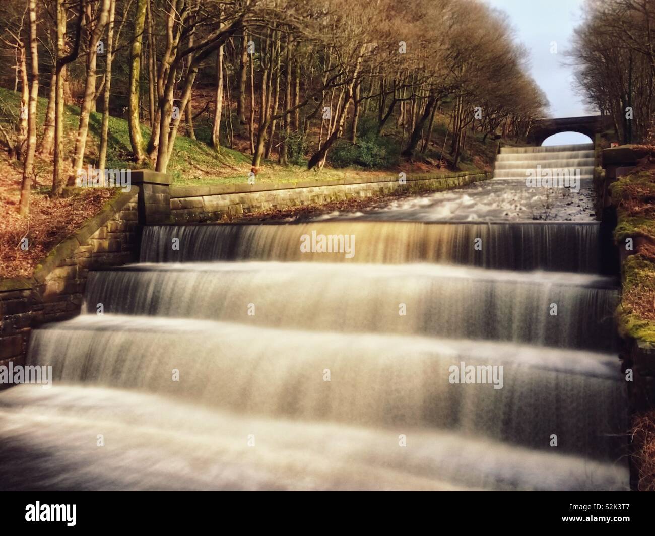 Water flowing from reservoir overflow. Overflow from Yarrow reservoir in Rivington, Lancashire - Smartphone Captured Stock Image