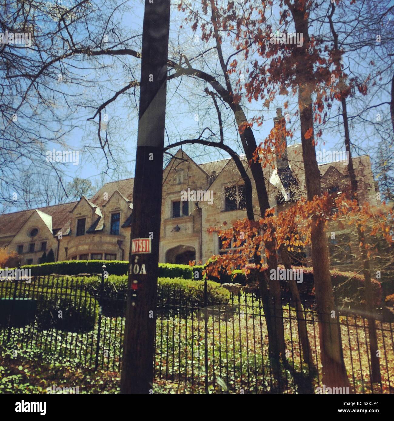 A large home behind a fence, Atlanta, Georgia, United States - Smartphone Captured Stock Image