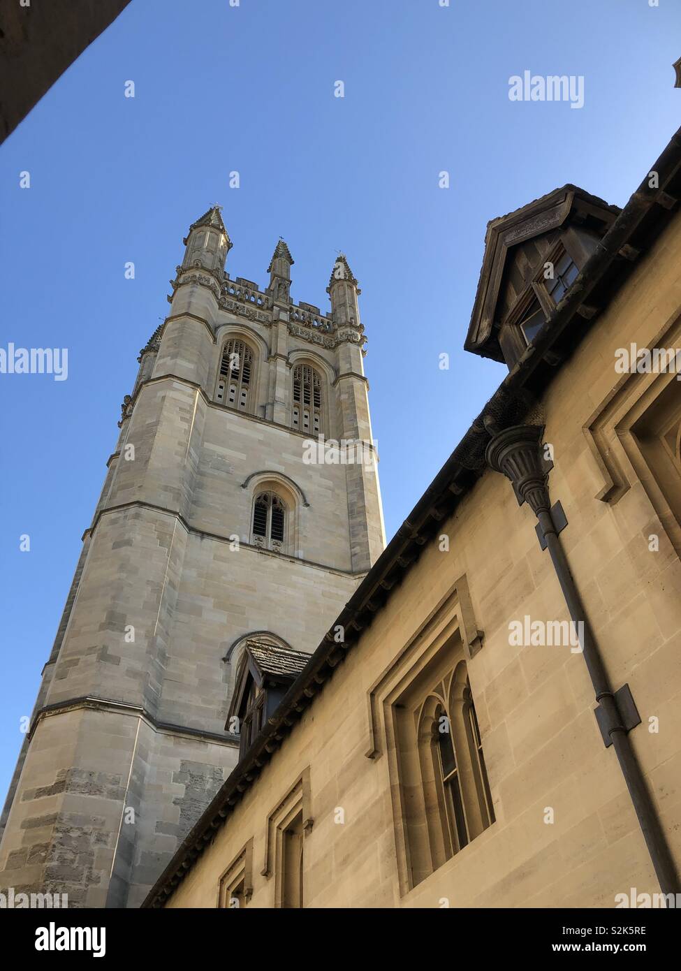 Magdalen College Tower from the Chaplains Quad in brilliant sunshine with blue sky. - Smartphone Captured Stock Image