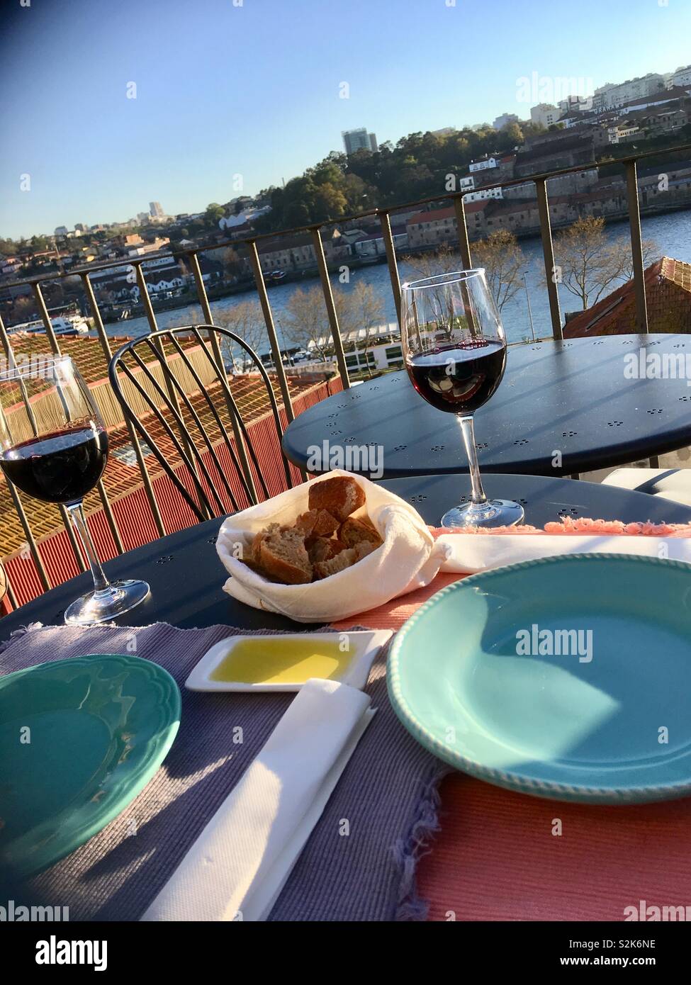 Lunch by the river, with a glass of red wine, in the sun Stock Photo