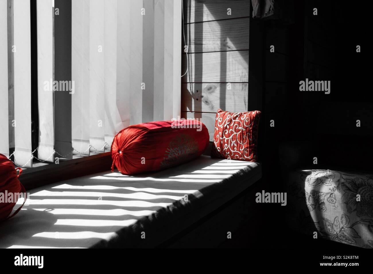 Red Cushion And Bolster On A Black And White Sunbed Streaked With Shadows And Sunlight Stock Photo Alamy