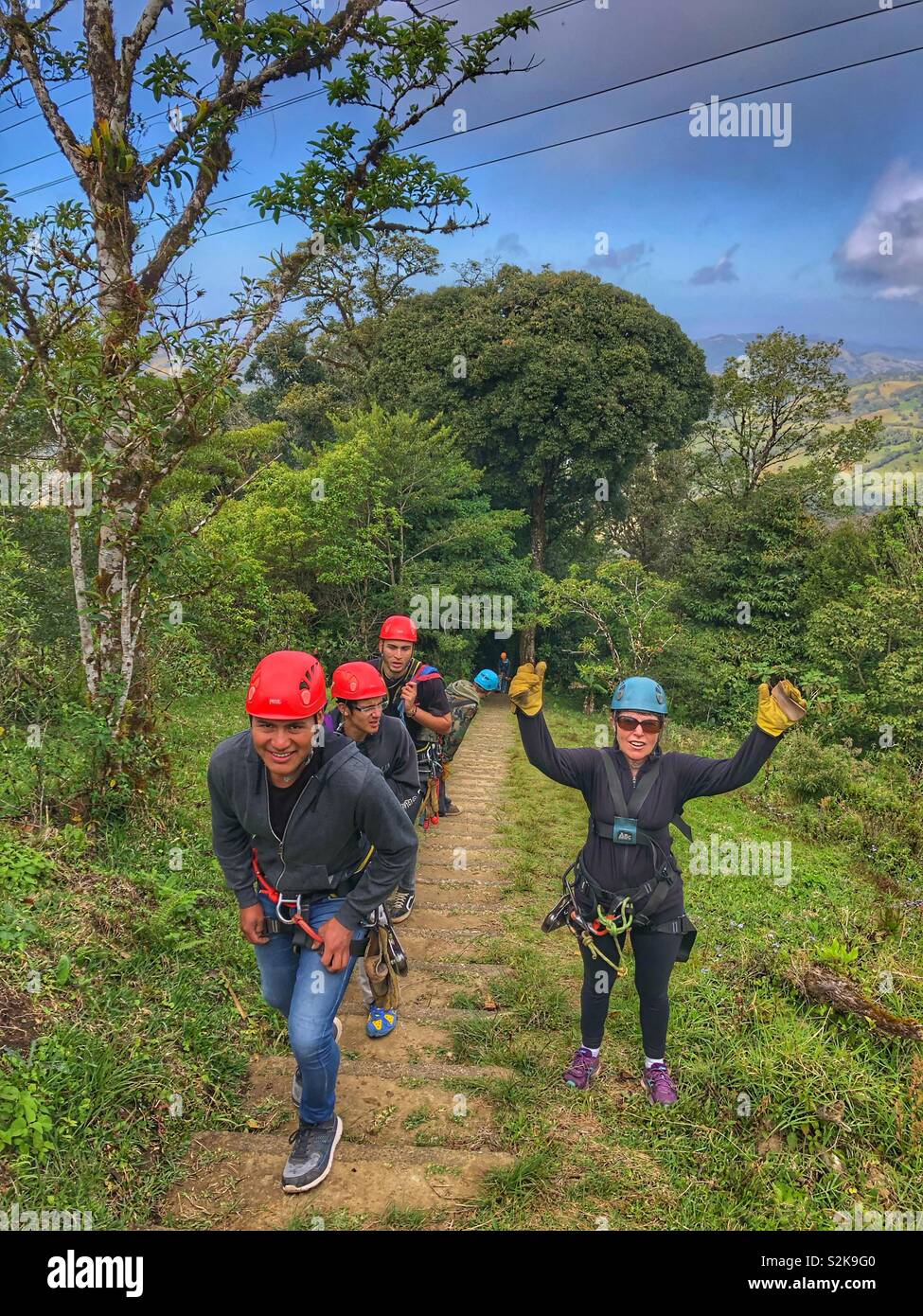 Walking up the path to the next zip line  at Extreme Park in Costa Rica. - Smartphone Captured Stock Image