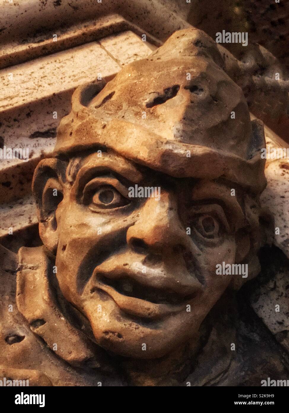 Interesting statue of the face of a hard working man laborer with lots of character. Stock Photo
