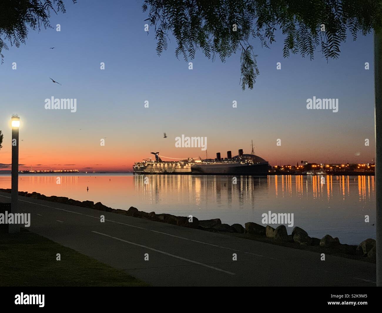 RMS Queen Mary at sunrise in Long Beach, California. Stock Photo