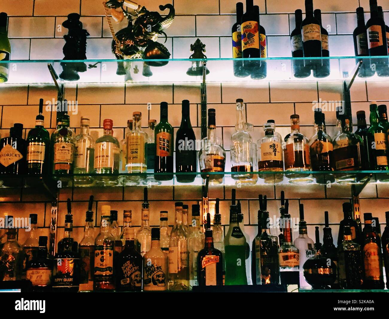 Bottles of spirits drinks on shelves in a cocktail bar - Smartphone Captured Stock Image