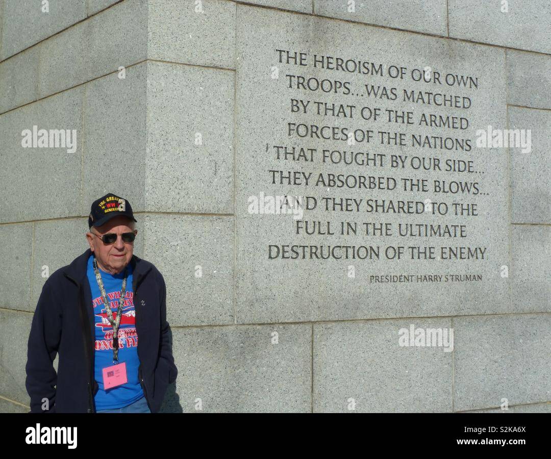 Veterans from World War II standing by the memorial dedicated to their service - Smartphone Captured Stock Image