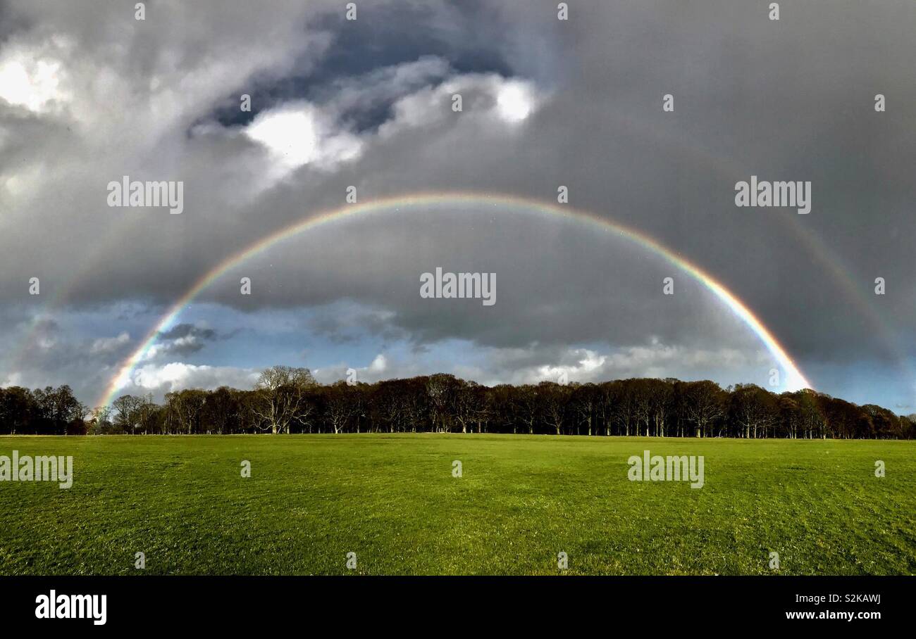A full rainbow in Phoenix Park, Dublin, Ireland. - Smartphone Captured Stock Image