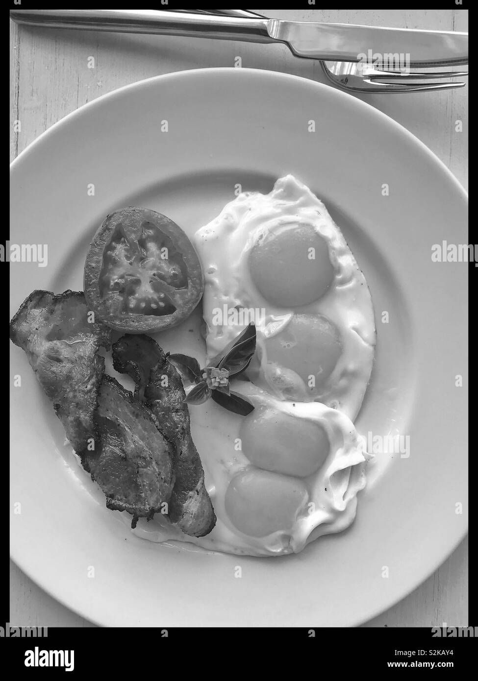 Two double yolk eggs and bacon. - Smartphone Captured Stock Image