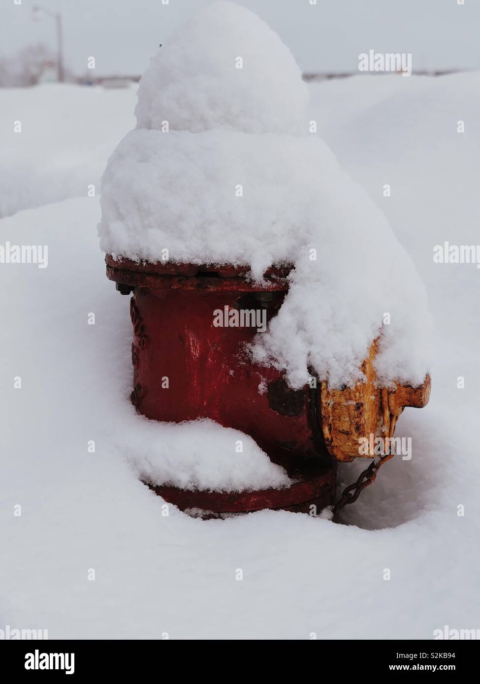 Snow covered fire hydrant. Stock Photo