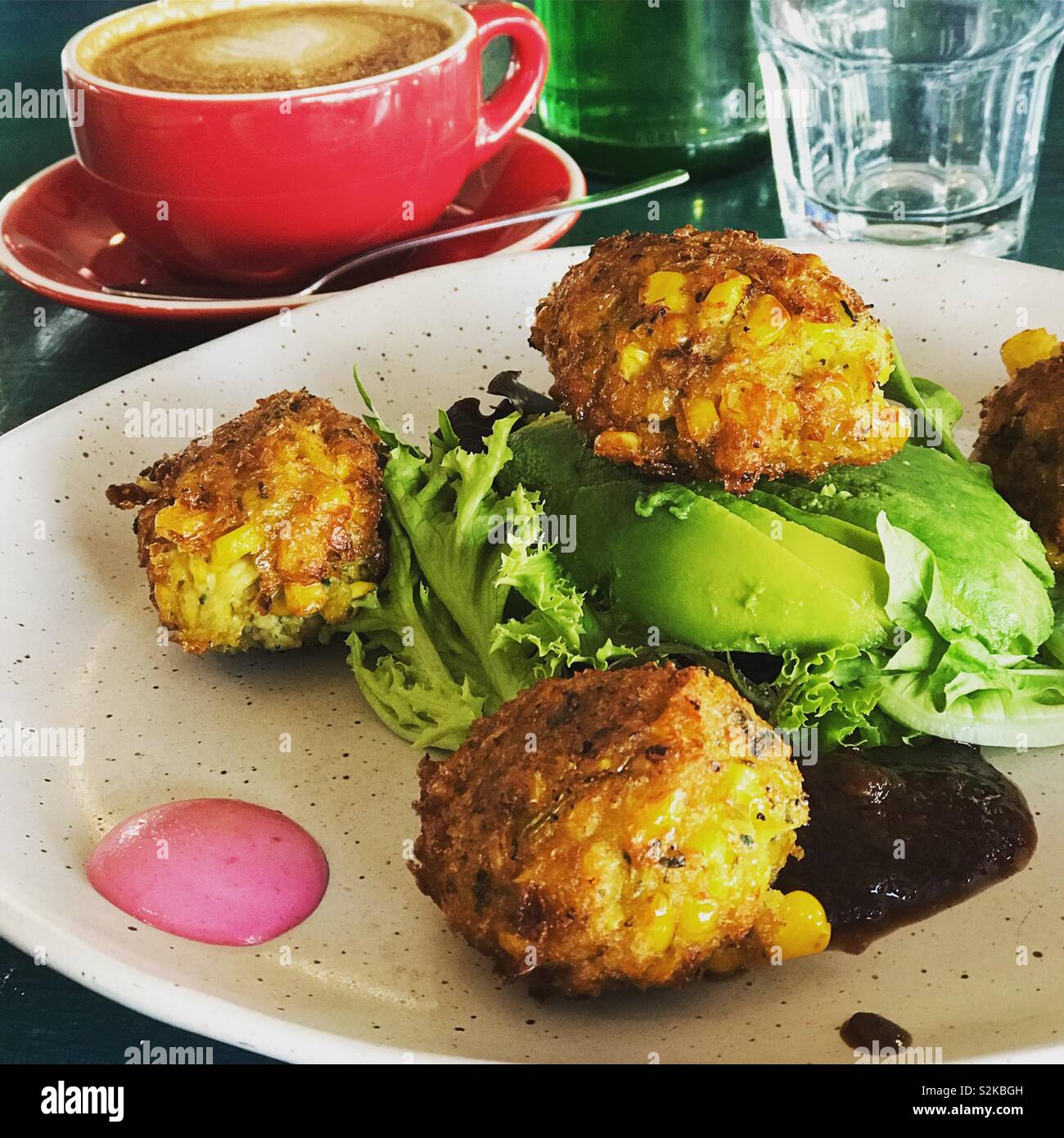 Corn Fritters for lunch with avocado and lettuce Stock Photo