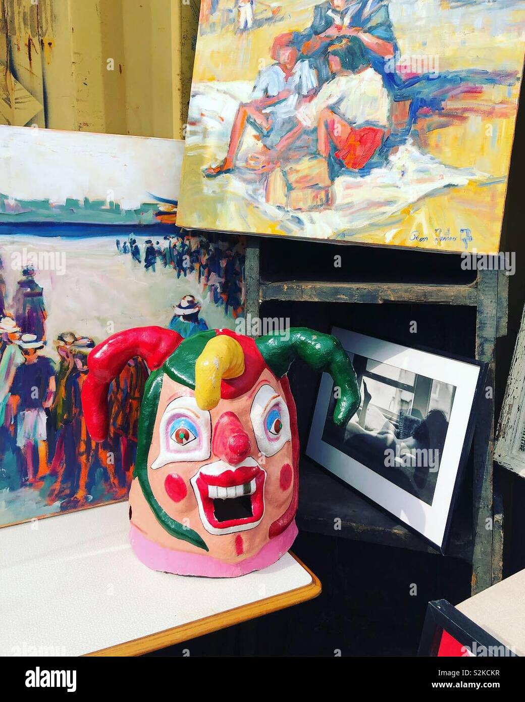 Jester mask at a flea market - Smartphone Captured Stock Image