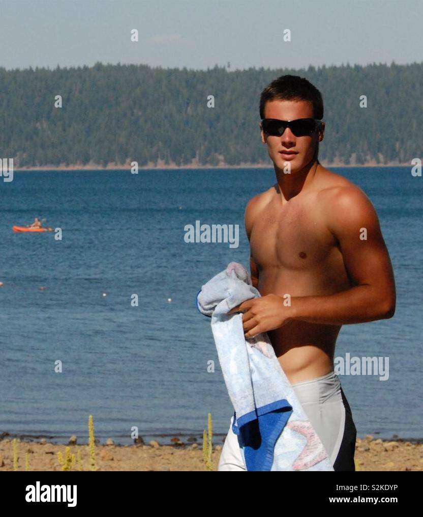 Young man in his 20s enjoying swimming, sun and lake in Wyoming USA - Smartphone Captured Stock Image