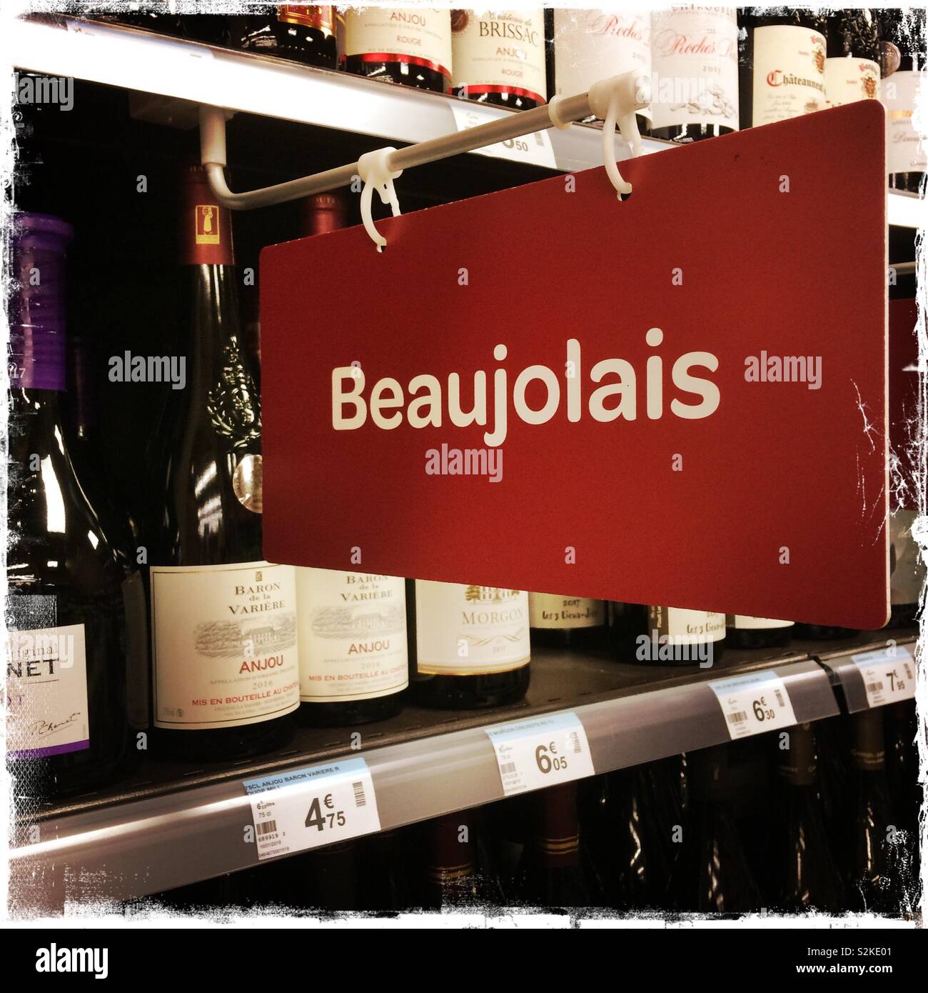 Beaujolais sign in wine section of a French supermarket. - Smartphone Captured Stock Image