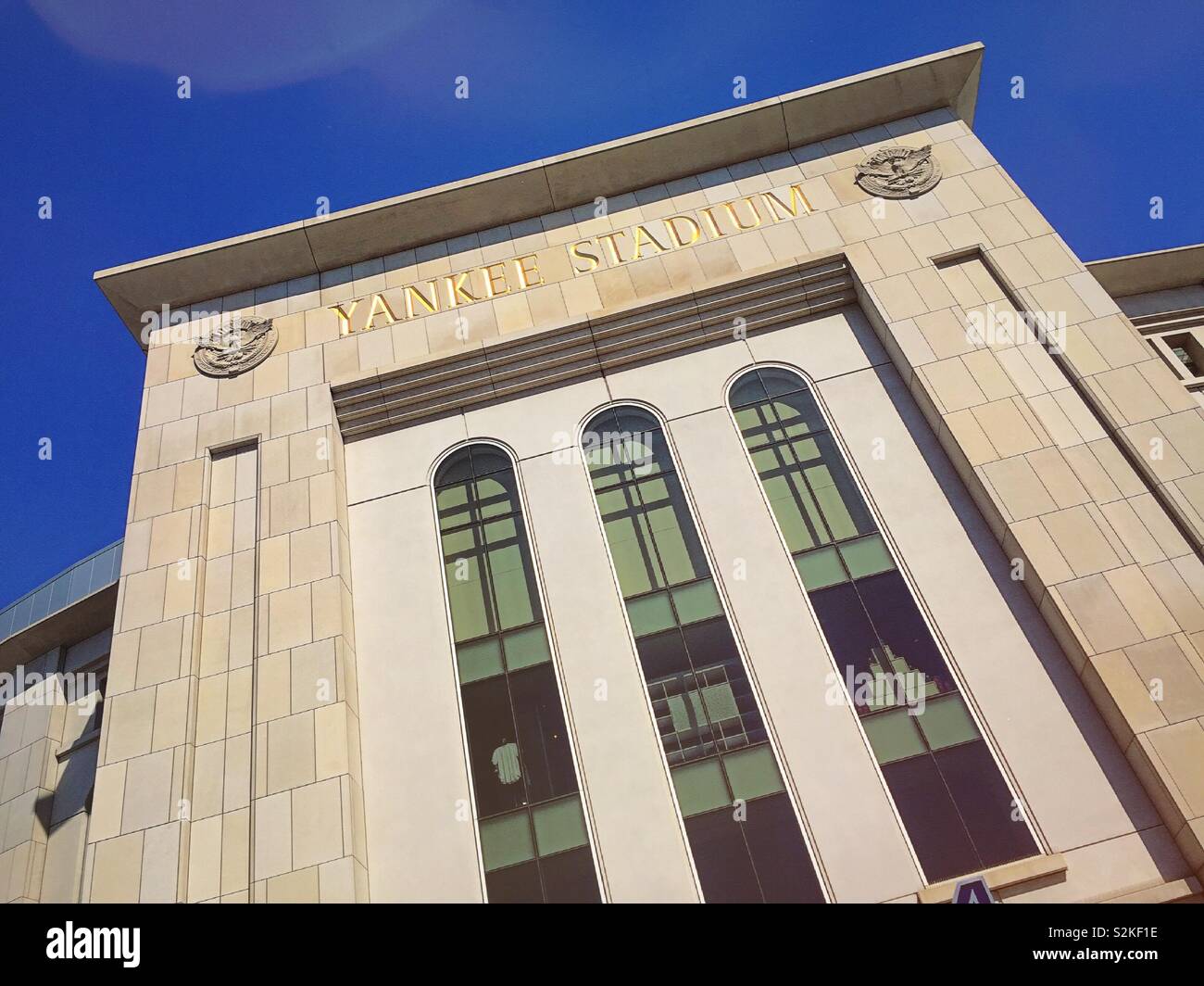 Close up of the façade of Yankee Stadium in the bright afternoon sun, the Bronx, NYC, USA - Smartphone Captured Stock Image