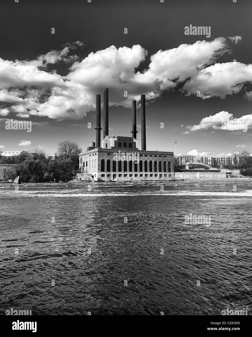 Power plant sits on the Mississippi River. Stock Photo