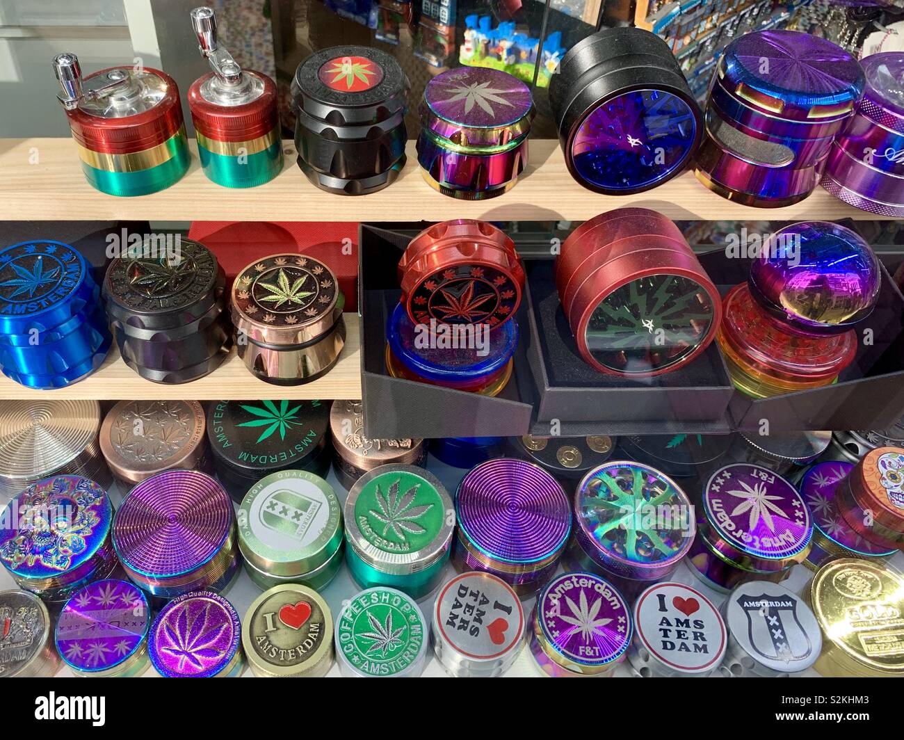 Amsterdam, Netherlands - 9th April 2019: Bright colourful cannabis tins on sale in central Amsterdam. - Smartphone Captured Stock Image