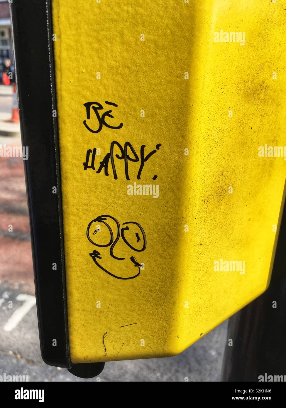 Be happy written on a crossing box - Smartphone Captured Stock Image