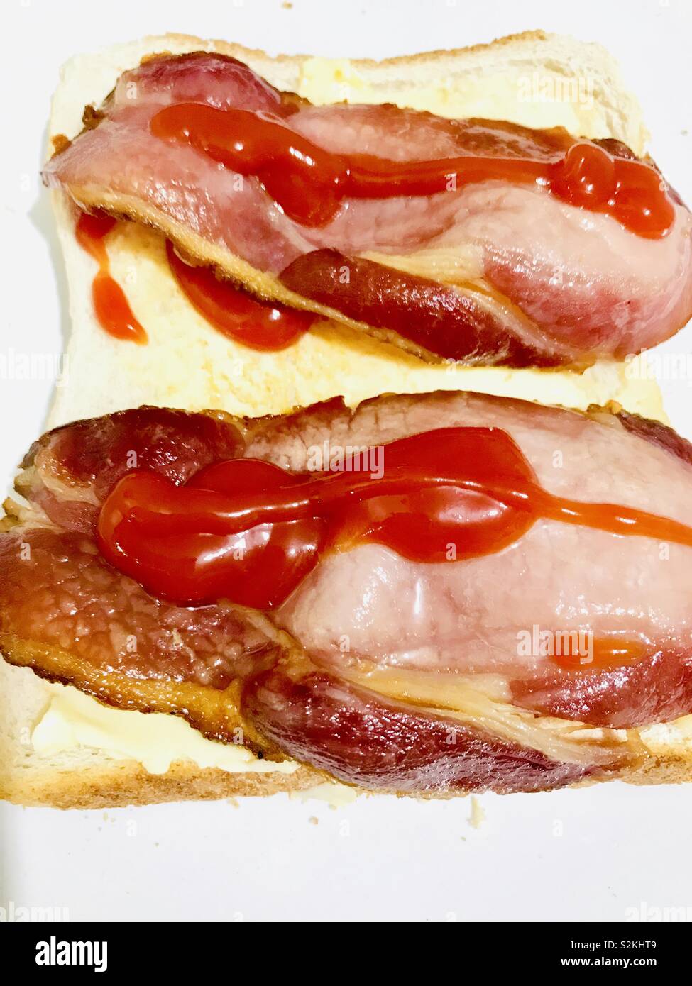 Bacon sandwich with tomato ketchup Stock Photo Alamy