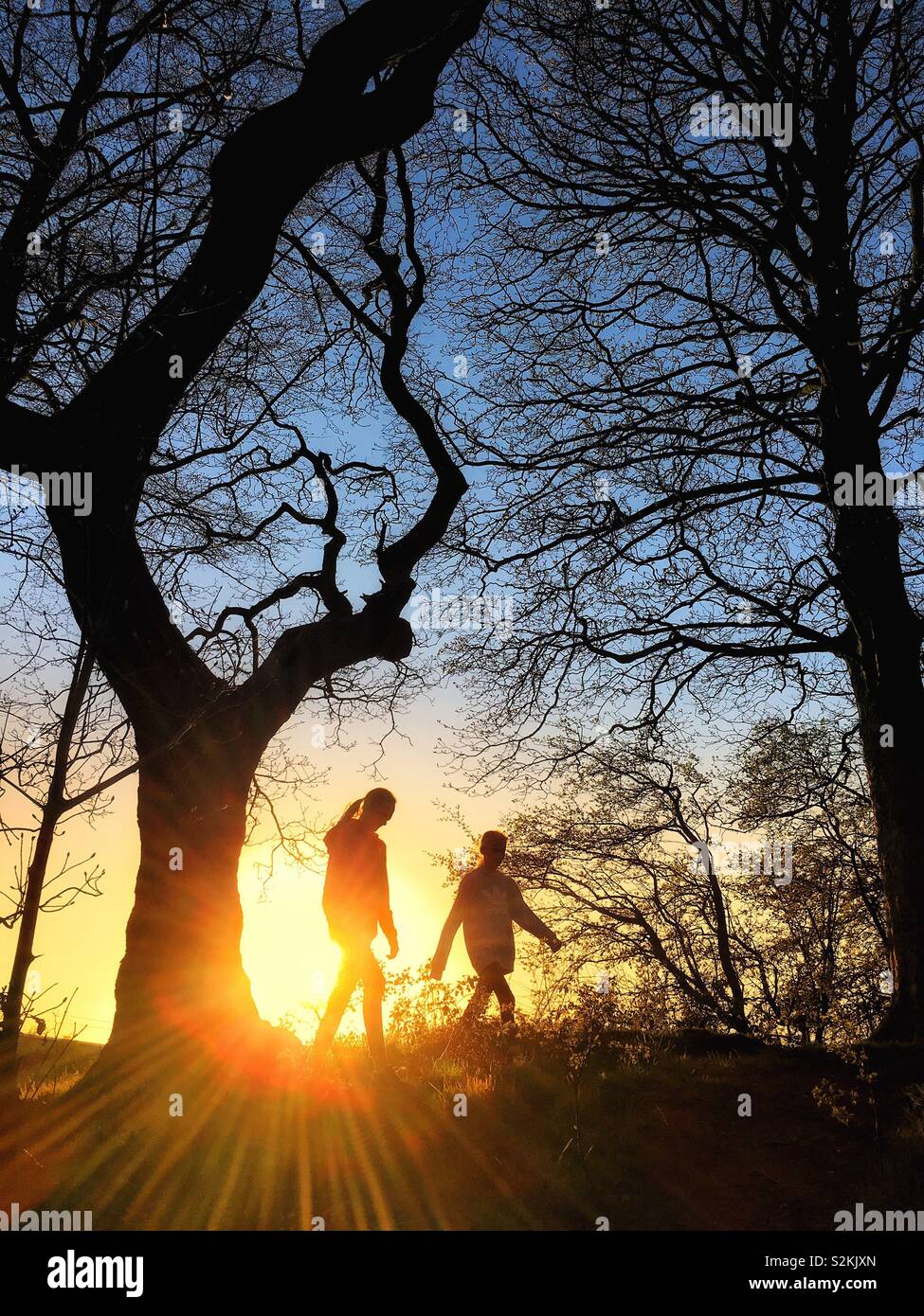 Two girls walking together hi-res stock photography and images - Alamy