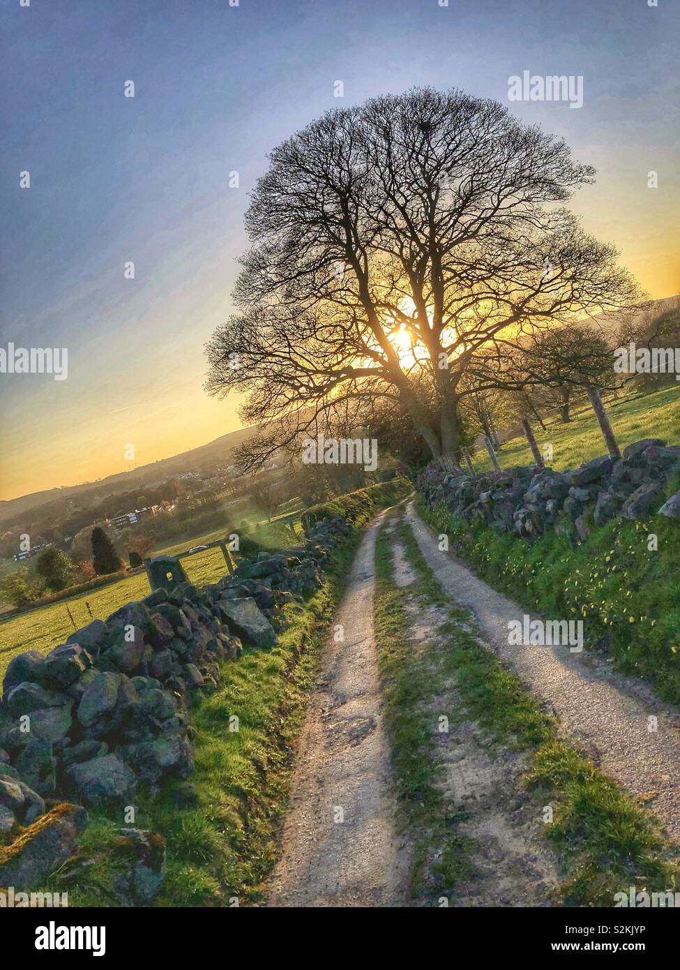Lovely sunset on Ilkley Moor from a country lane in Guiseley West Yorkshire UK Weather Stock Photo
