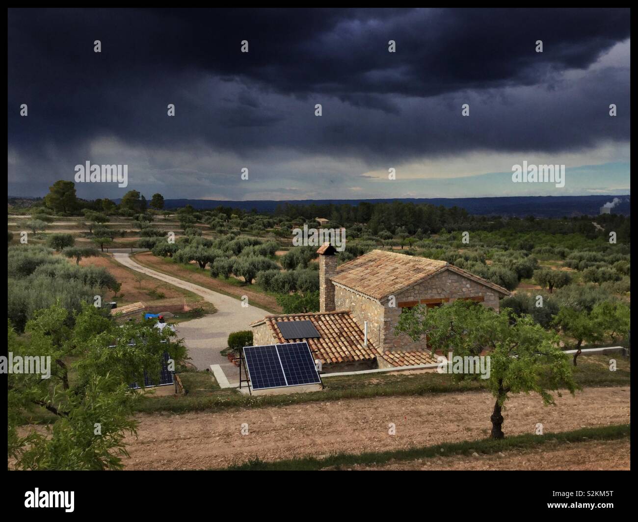 Storm clouds over the olive farm, Catalonia, Spain. - Smartphone Captured Stock Image