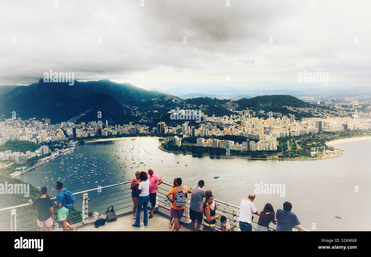 Tourists enjoying the view from Sugarloaf mountain in Rio de Janeiro, Brazil - Smartphone Captured Stock Image