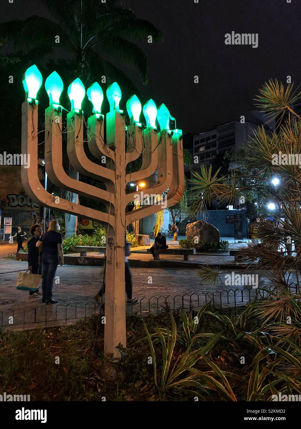 A lit menorah in a public park in Rio de Janeiro, Brazil. - Smartphone Captured Stock Image