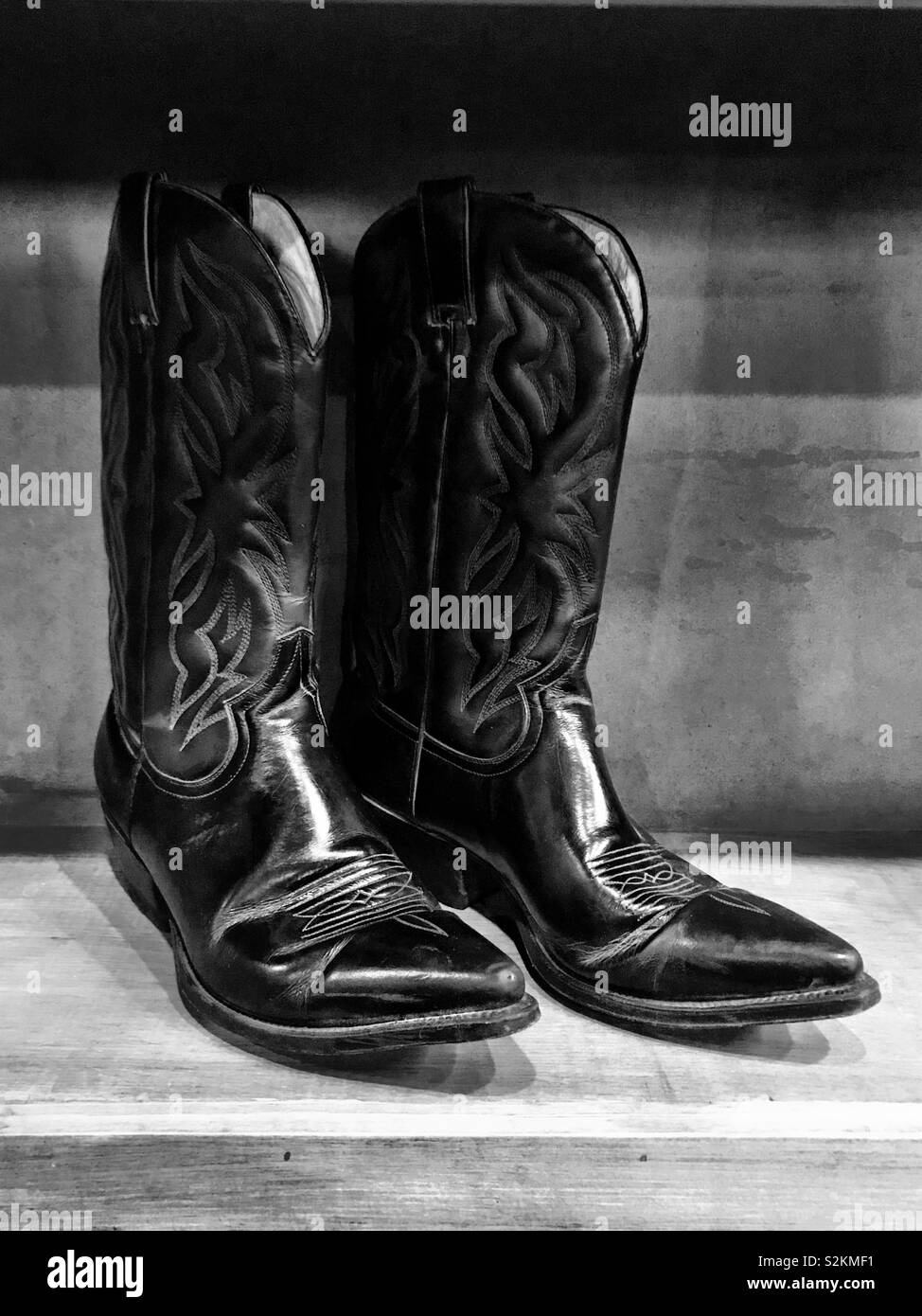 Pair of black cowboy boots Stock Photo Alamy