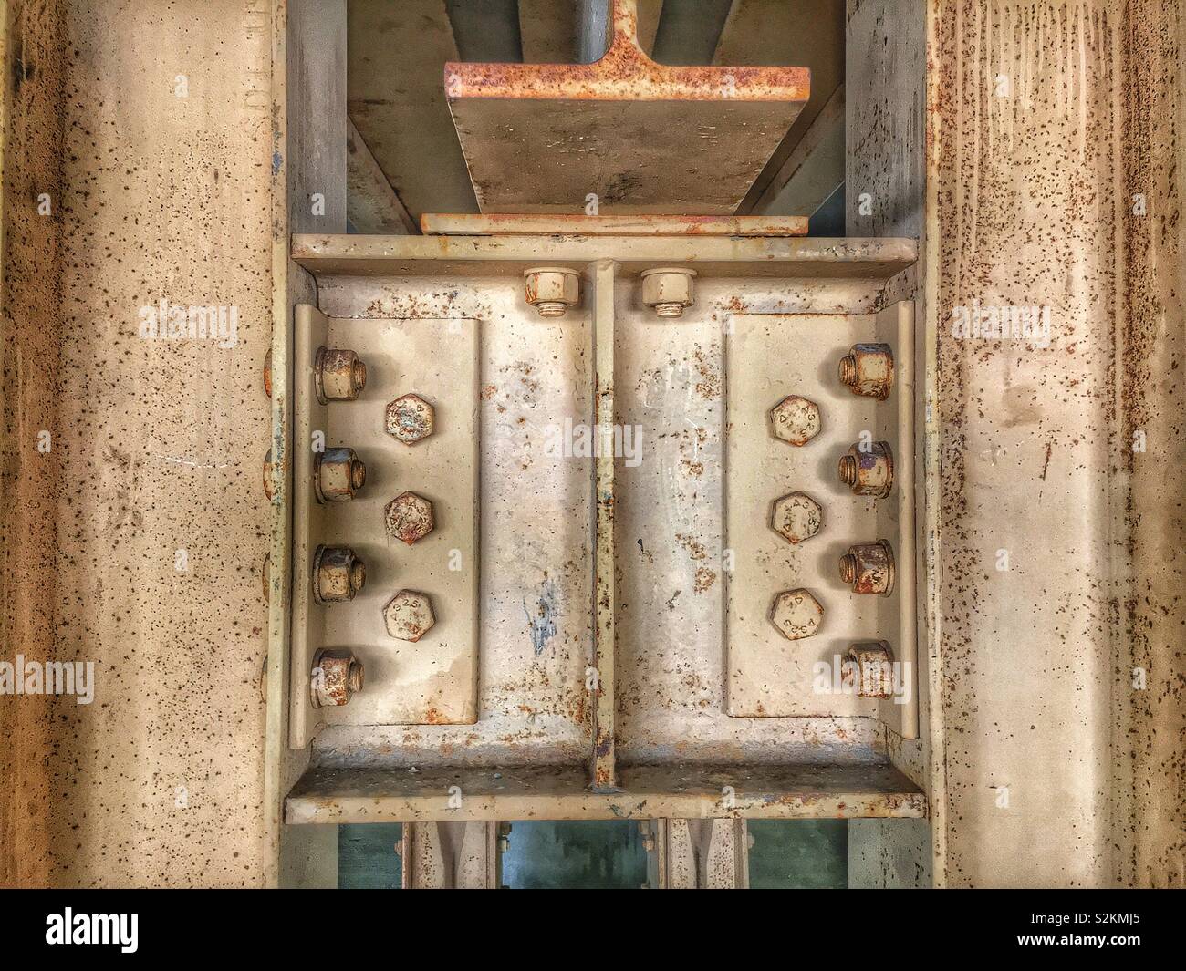 Strong heavy and authentic rusted steel connection in a grimy old Chicago car parking garage. - Smartphone Captured Stock Image