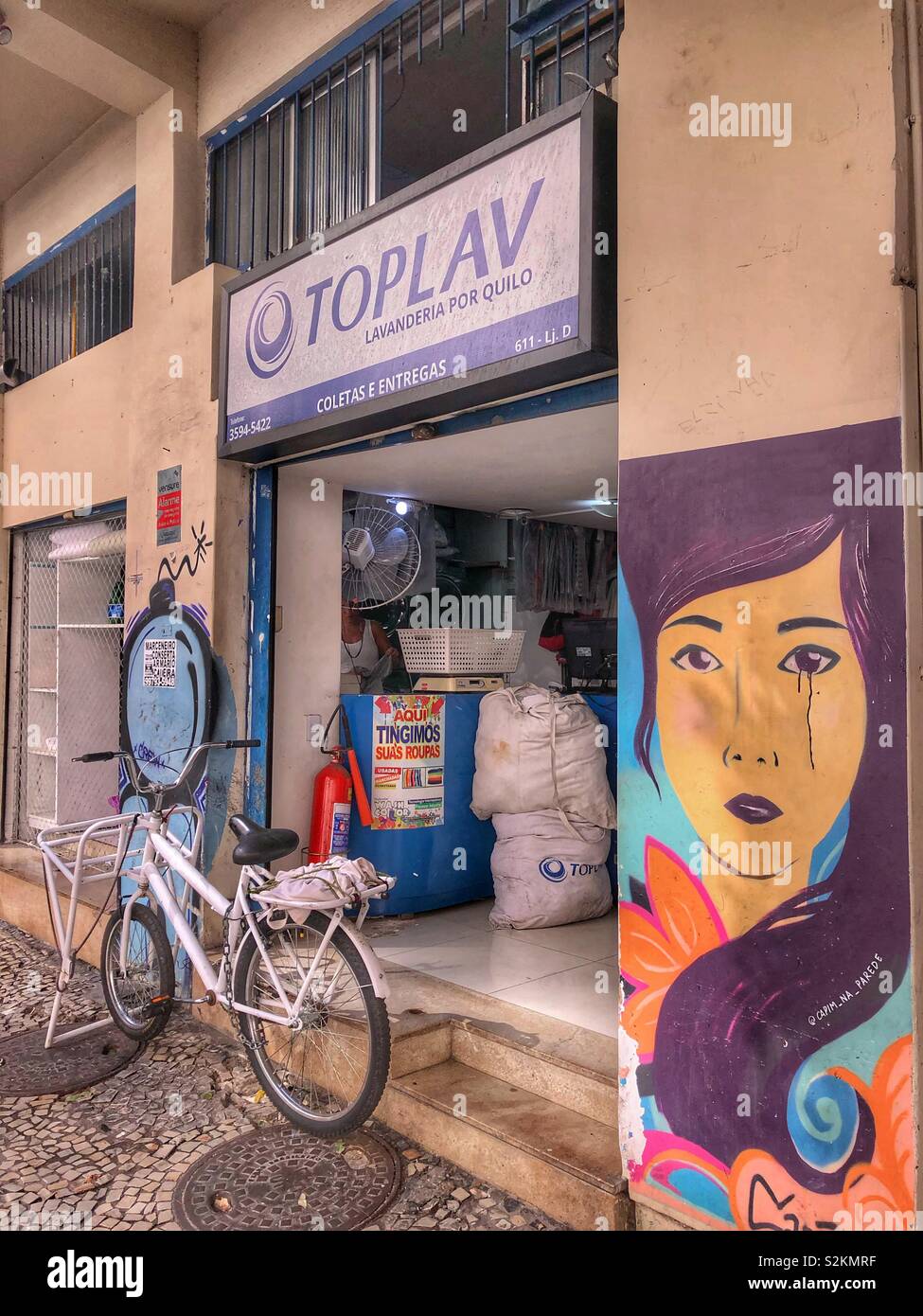 Street art on the wall of a laundromat in Rio de Janeiro, Brazil. - Smartphone Captured Stock Image