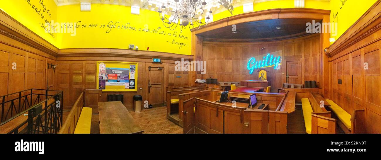 Chill out area at the Clink78 hostel in Kings Cross, The hostel used to be a courthouse and this is one of the original courts. - Smartphone Captured Stock Image