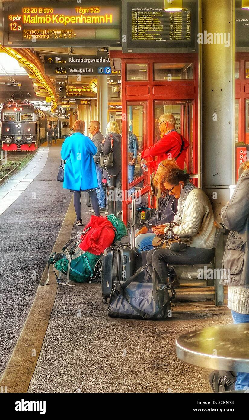 Passengers waiting for the international Stockholm to Copenhagen train, Stockholm Central Station, Sweden, Scandinavia - Smartphone Captured Stock Image