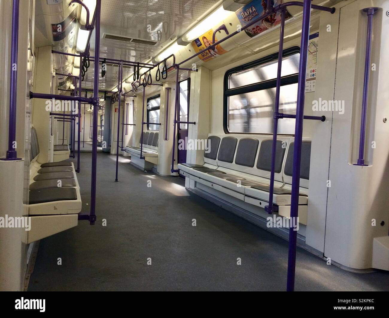 Empty tube underground coach wagon in movement while passing a station. Sofia metro train interior. Bulgaria. - Smartphone Captured Stock Image