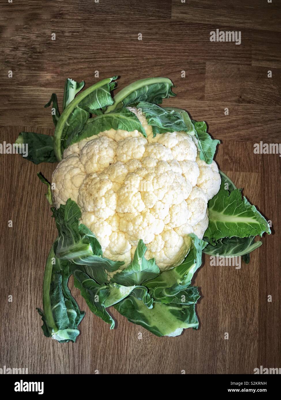 What a Beaut. Wholesome food. Freshly cut cauliflower . Stock Photo