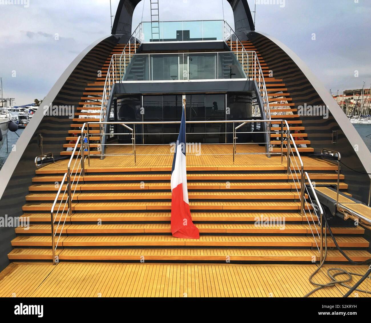 Wooden decking and steps on the sleek superyacht “Ocean Sapphire” - Smartphone Captured Stock Image