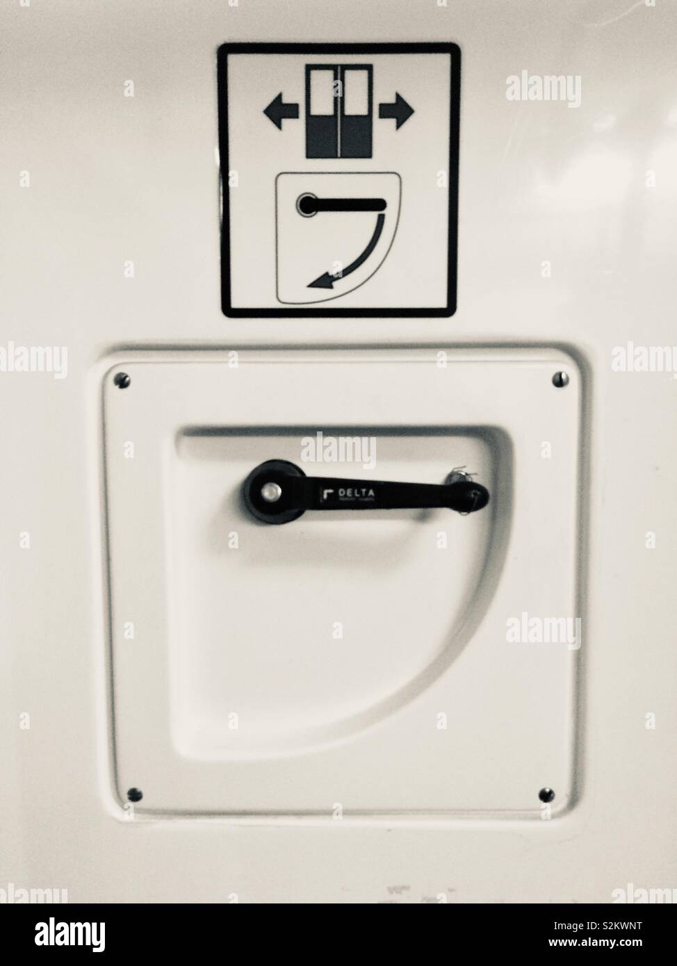 Emergency door opening device. Old fashioned handle for opening a train coach wagon door. - Smartphone Captured Stock Image