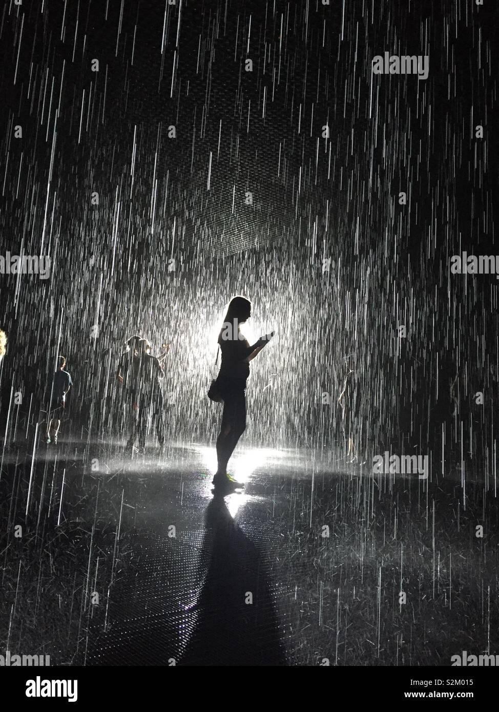 Woman standing in rain hi-res stock photography and images - Alamy