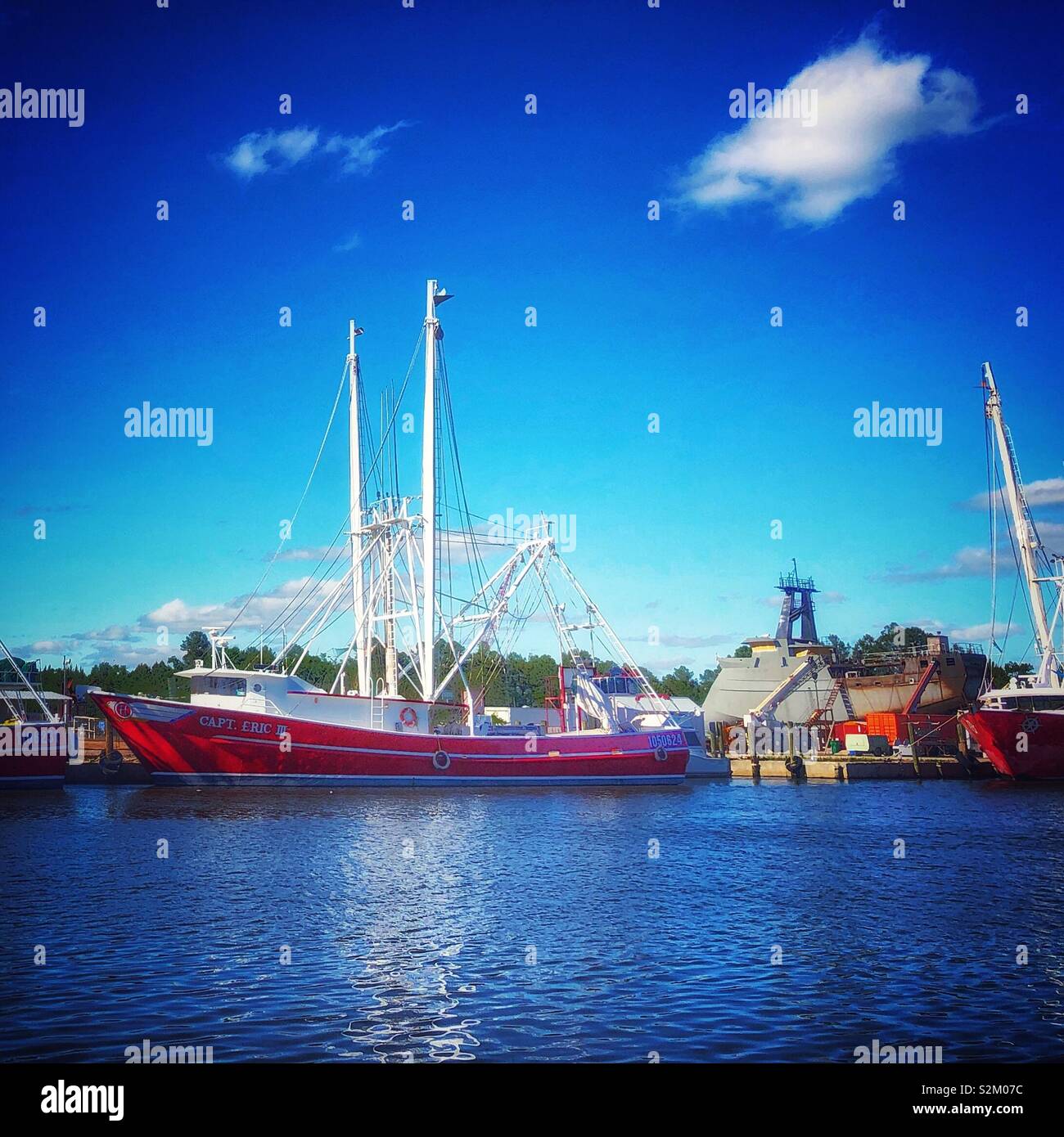 A shrimp boat is docked on a sunny day in Bayou La Batre, Alabama. Stock Photo