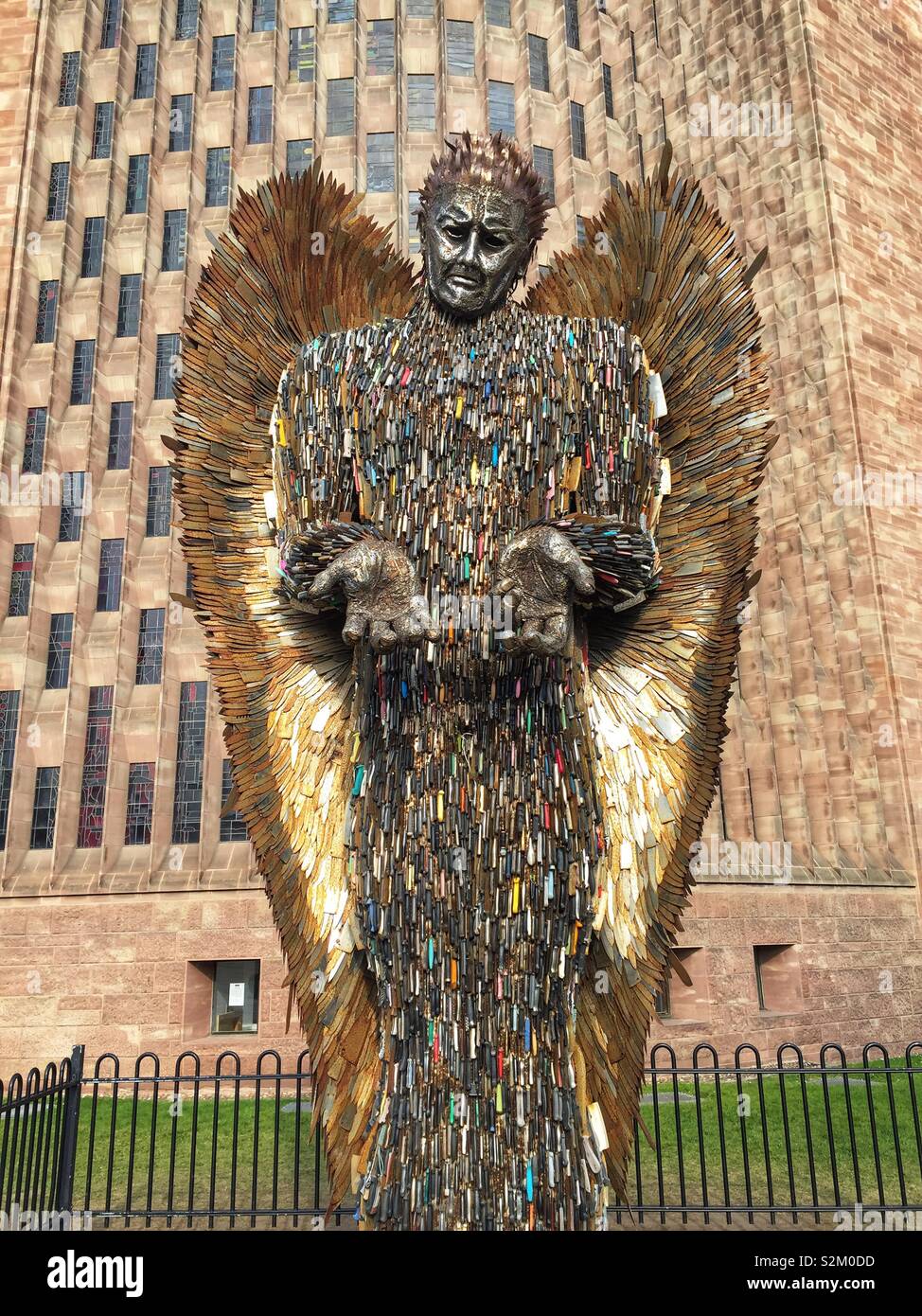 Knife Angel sculpture outside Coventry Cathedral. Designed by Alfie Bailey as a monument against violence and aggression. It standing at 27ft 8m tall it is made from 100,000 blades handed into police Stock Photo