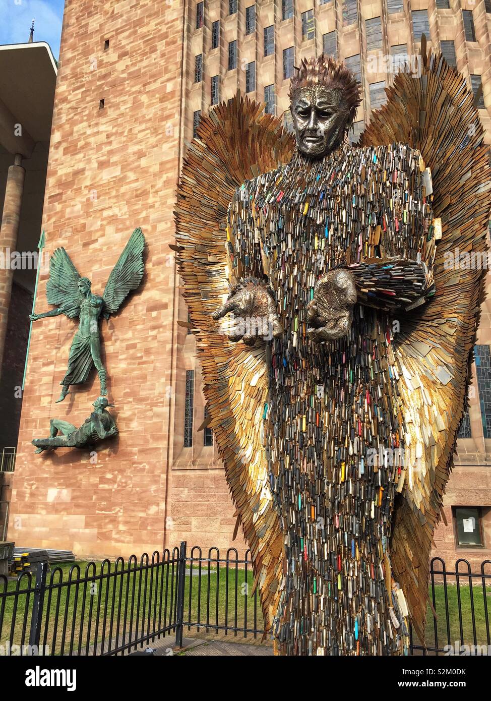Knife Angel sculpture outside Coventry Cathedral. Designed by Alfie Bailey as a monument against violence and aggression. It standing at 27ft 8m tall it is made from 100,000 blades handed into police Stock Photo