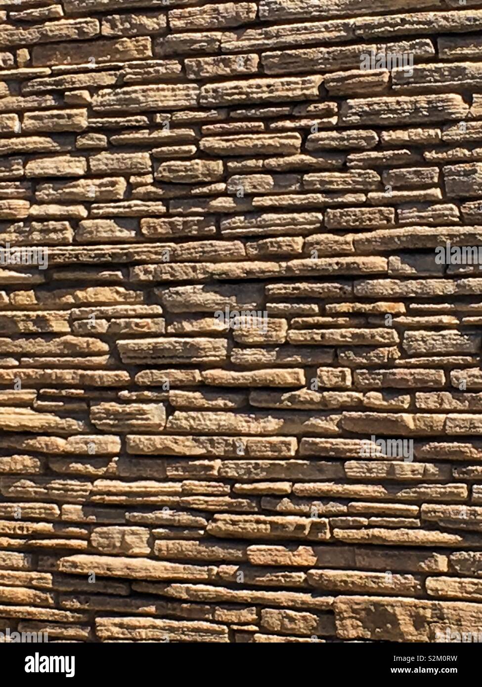 Old worn limestone wall. - Smartphone Captured Stock Image