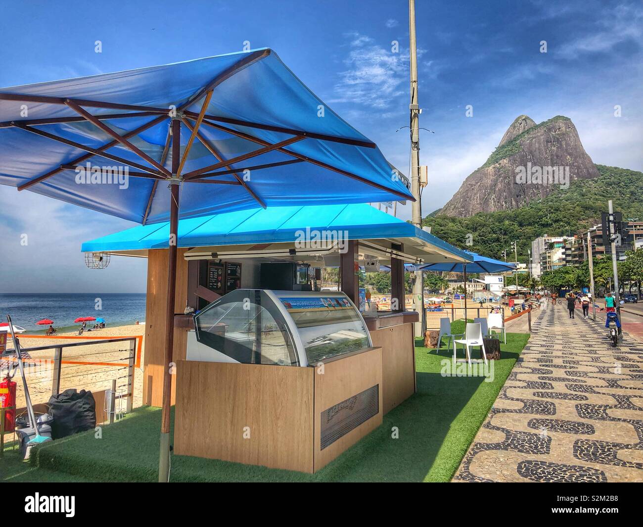 An ice cream kiosk on the Ipanema beach promenade in Rio de Janeiro, Brazil. - Smartphone Captured Stock Image